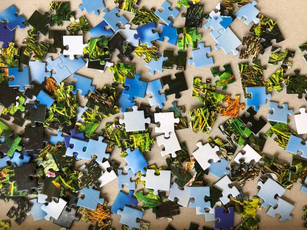 Colorful jigsaw puzzle pieces in a box