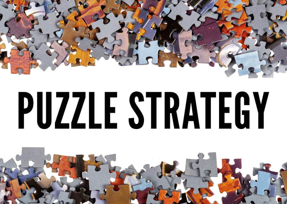 Puzzle pieces with text overlay "Puzzle Strategy"