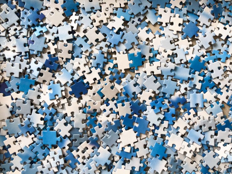 Blue and white jigsaw puzzle pieces