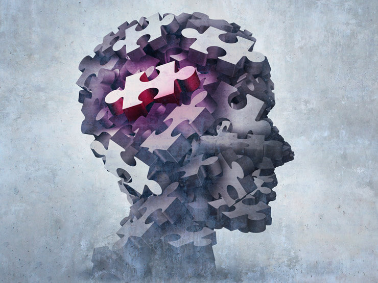 An abstract head made up of puzzle pieces