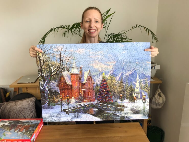 Veronika with a finished Christmas jigsaw puzzle