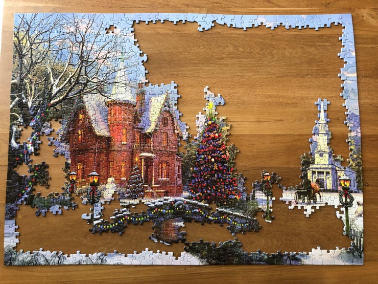 Half-finished puzzle with a Christmas theme