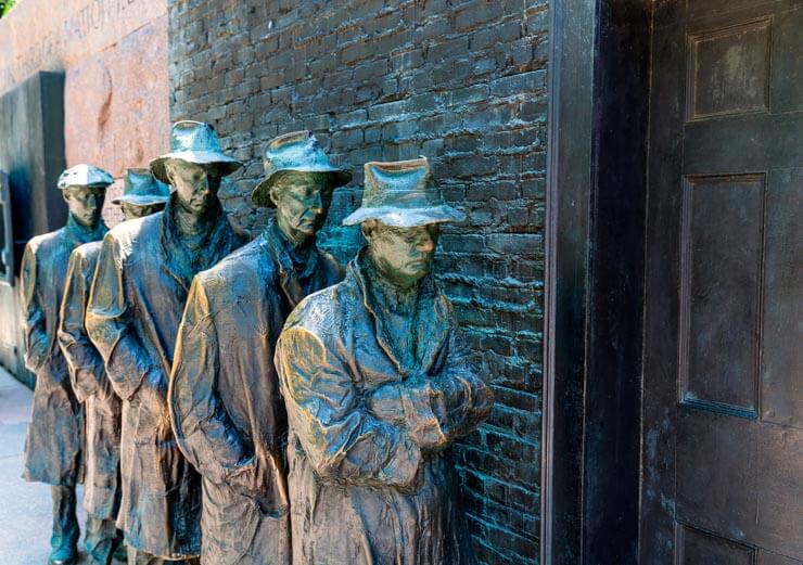 Sculptures of men waiting in a bread line during the Great Depression - part of the FDR Memorial in Washington, DC