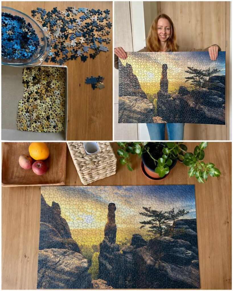 A collage follows a mountain sunset jigsaw puzzle from sorted blue and yellow pieces to the finished scene. A smiling woman holds the completed puzzle before it is displayed flat on a wooden table.